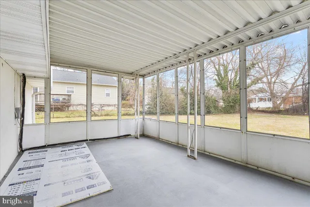 a view of an empty room with a large window