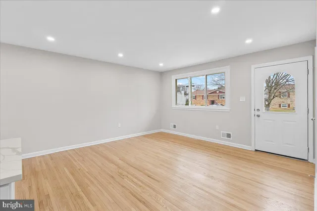 wooden floor in a room with a window