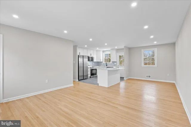 a view of kitchen with wooden floor