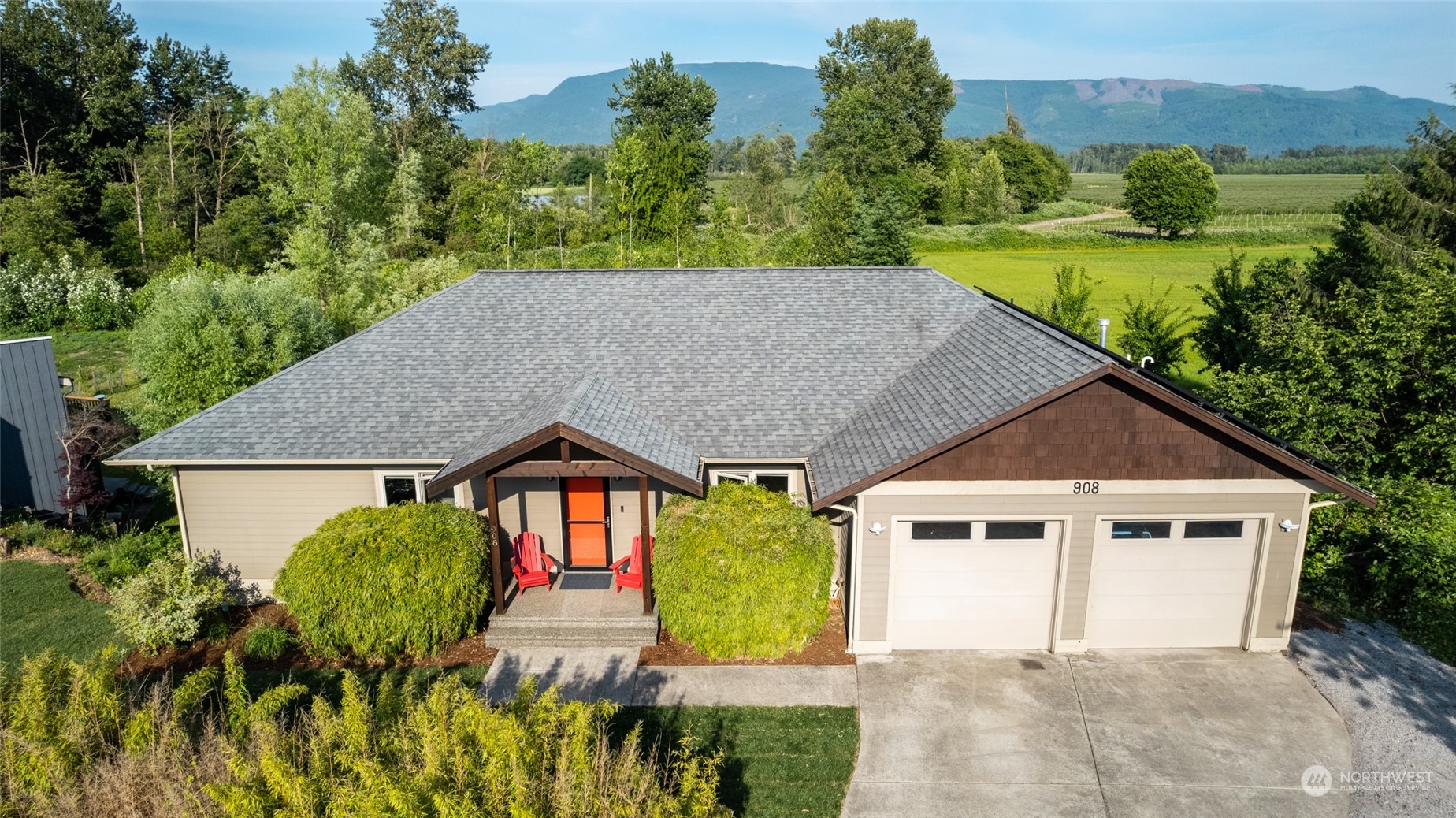 a view of a house with pool and garden