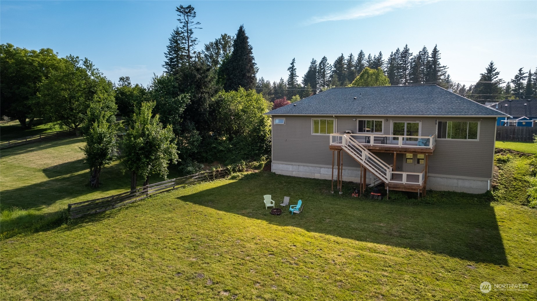908 Mission Road Everson, WA 98247 - Photo 11 of 40 a backyard of a house with yard table and chairs