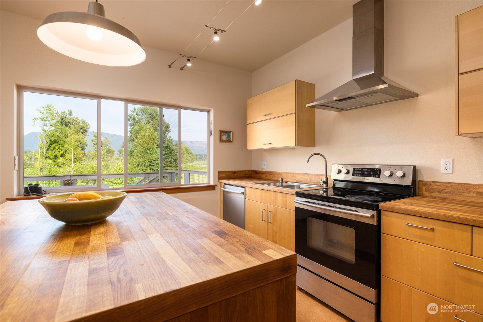 908 Mission Road Everson, WA 98247 - Photo 13 of 40 a kitchen with a stove and a sink