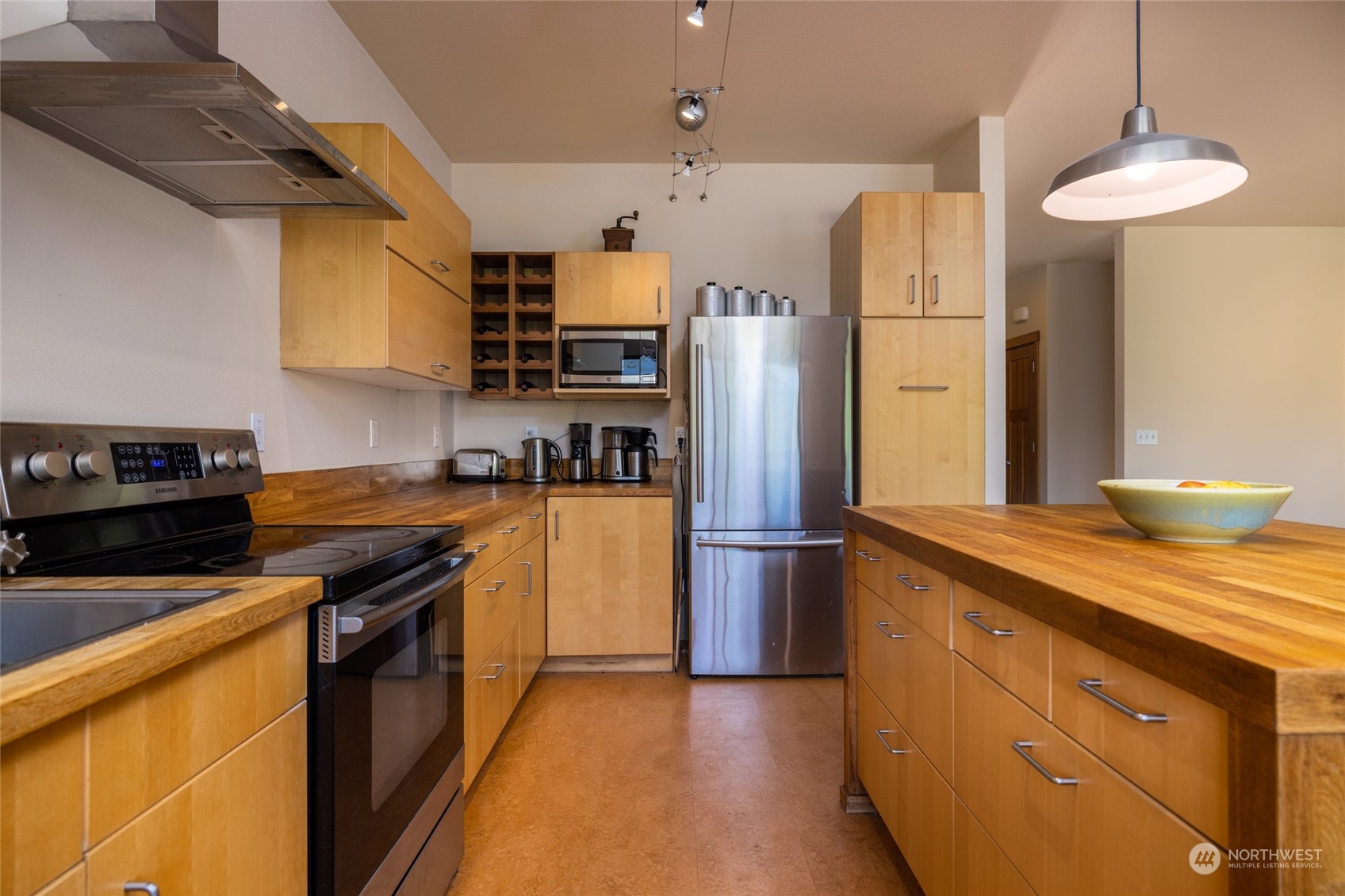 908 Mission Road Everson, WA 98247 - Photo 14 of 40 a kitchen with stainless steel appliances granite countertop a refrigerator a stove a sink dishwasher and a refrigerator with wooden floor