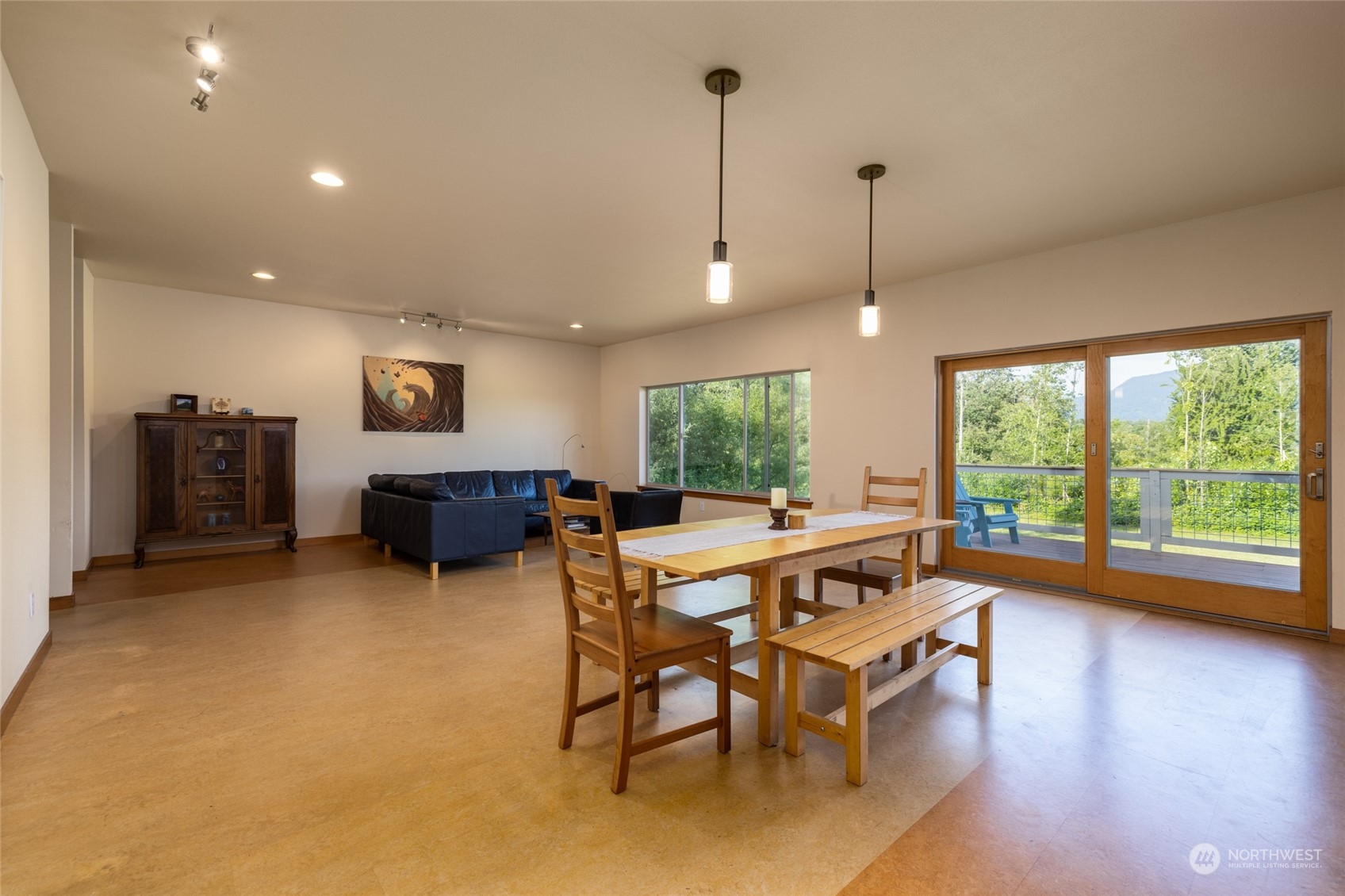 908 Mission Road Everson, WA 98247 - Photo 19 of 40 a living room with furniture a large window and wooden floor