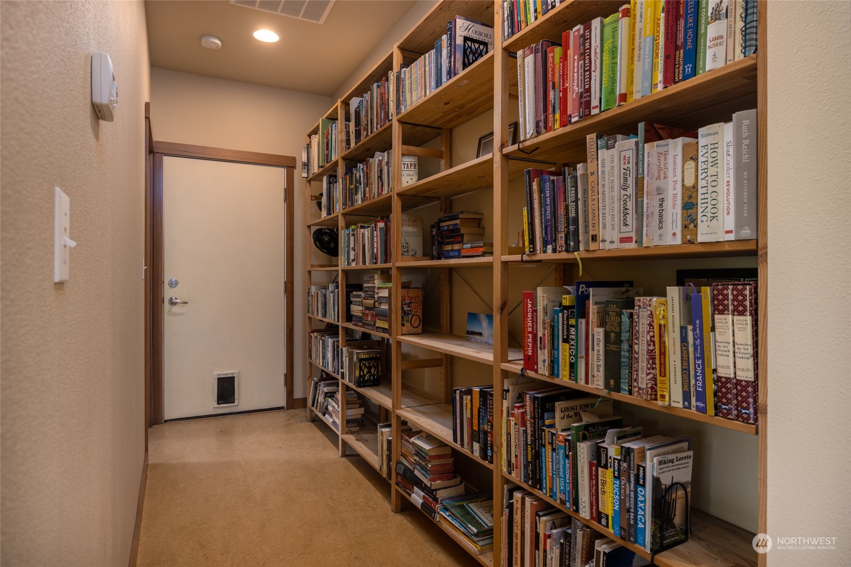 908 Mission Road Everson, WA 98247 - Photo 22 of 40 a view of a book shelf with shelves