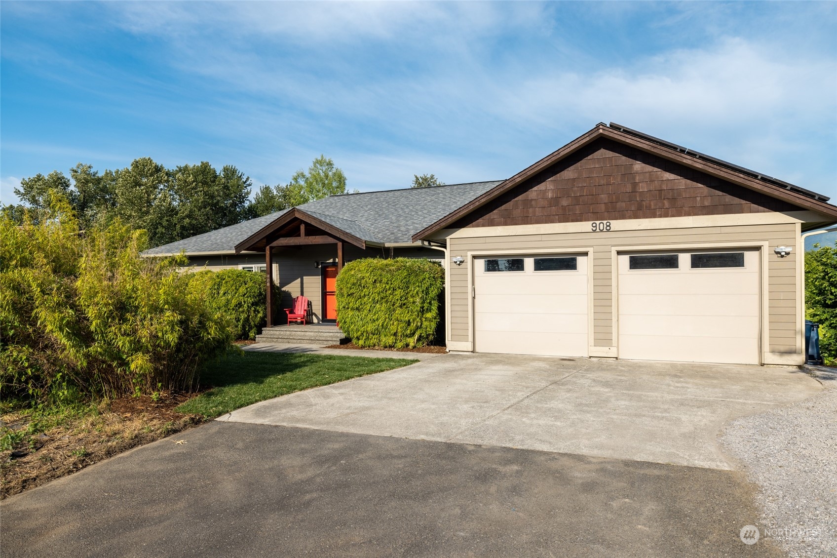 908 Mission Road Everson, WA 98247 - Photo 3 of 40 a front view of a house with a yard and garage
