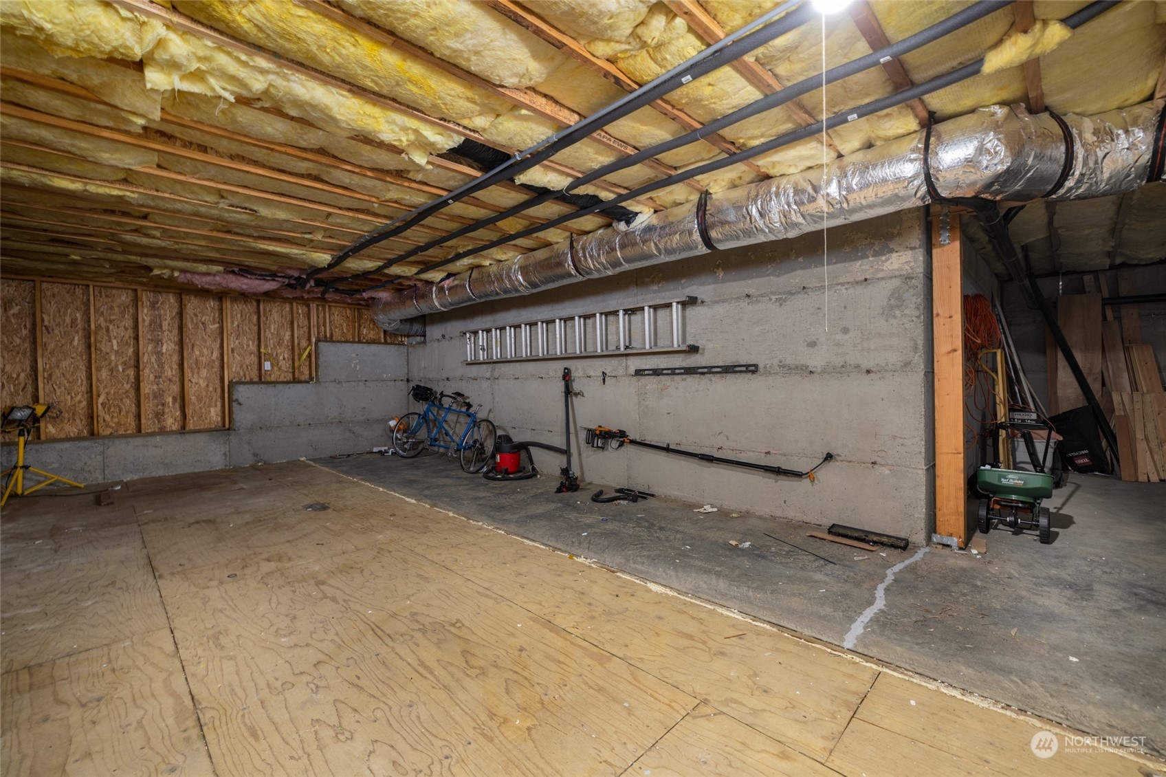 908 Mission Road Everson, WA 98247 - Photo 39 of 40 a view of a garage with wooden walls