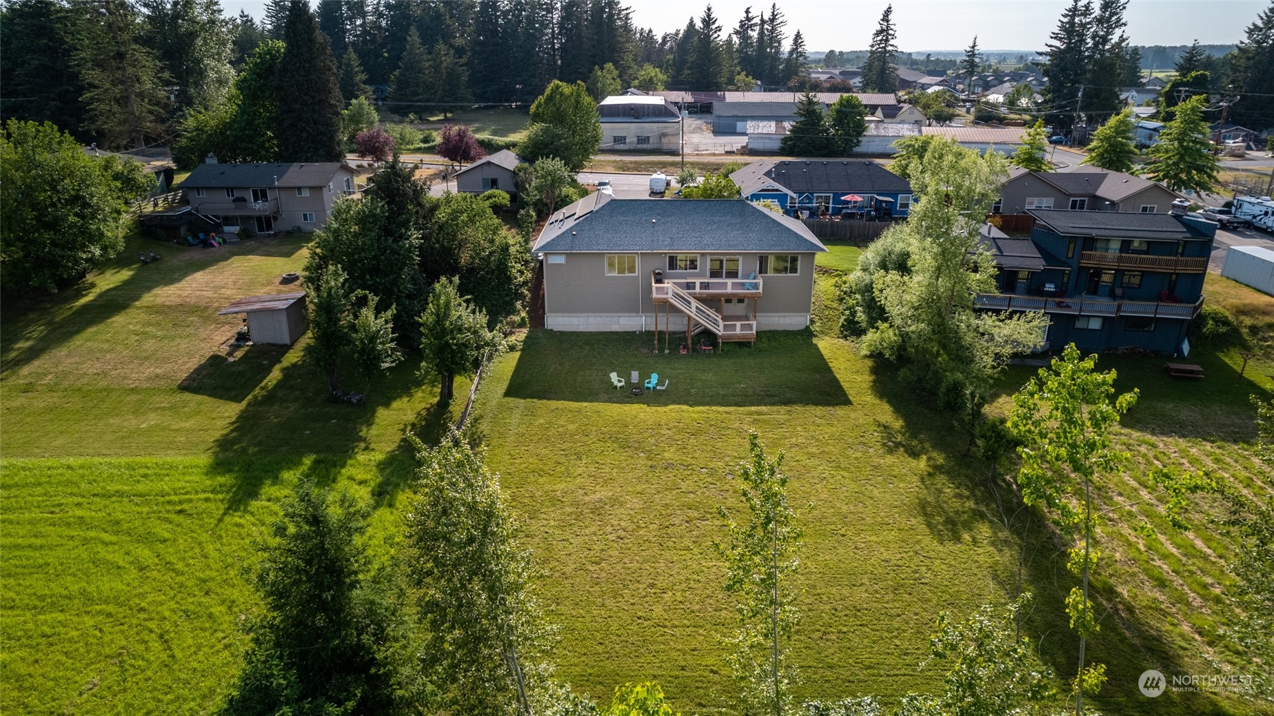 908 Mission Road Everson, WA 98247 - Photo 10 of 40 a view of a house with a garden and lake view