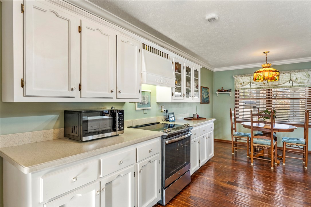 187 Teri Drive Liberty, SC 29657 - Photo 9 of 50 White cabinet kitchen with corian counter tops