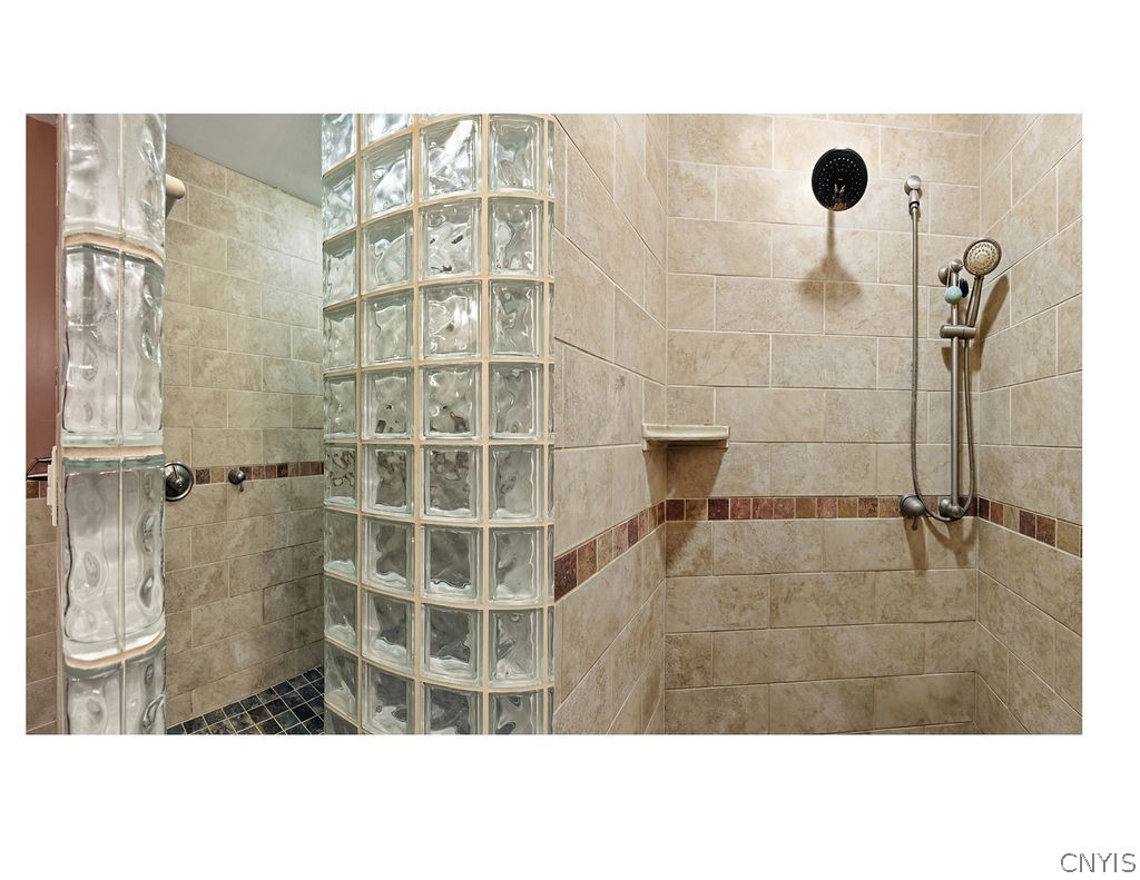 1000 Rail Fence Road Camillus, NY 13031 - Photo 22 of 37 A beautifully tiled, glass-enclosed shower adds a