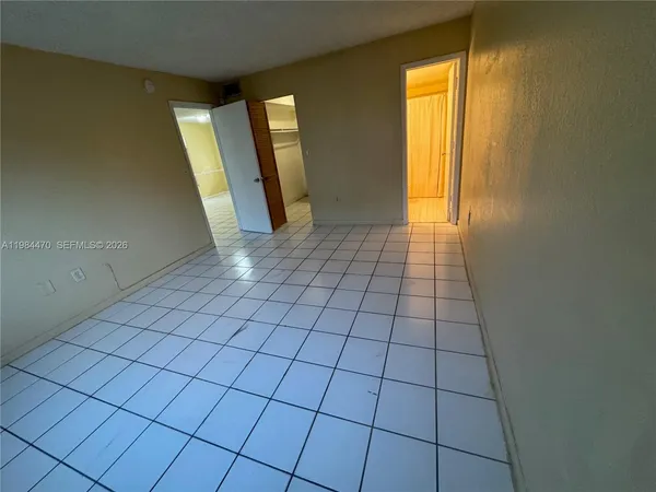 a view of an empty room and window