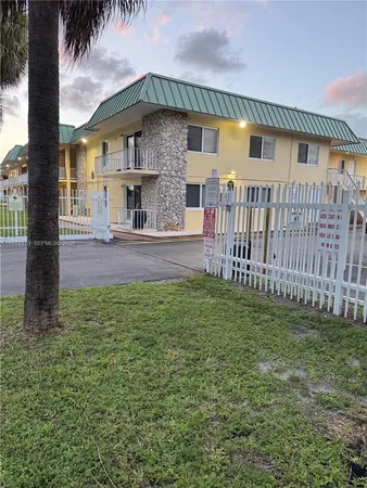 a view of a backyard of the house