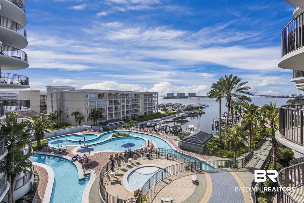 27582 Canal Road, Unit 2408 Orange Beach, AL 36561 - Photo 29 of 47 View of pool with a hot tub and a water view