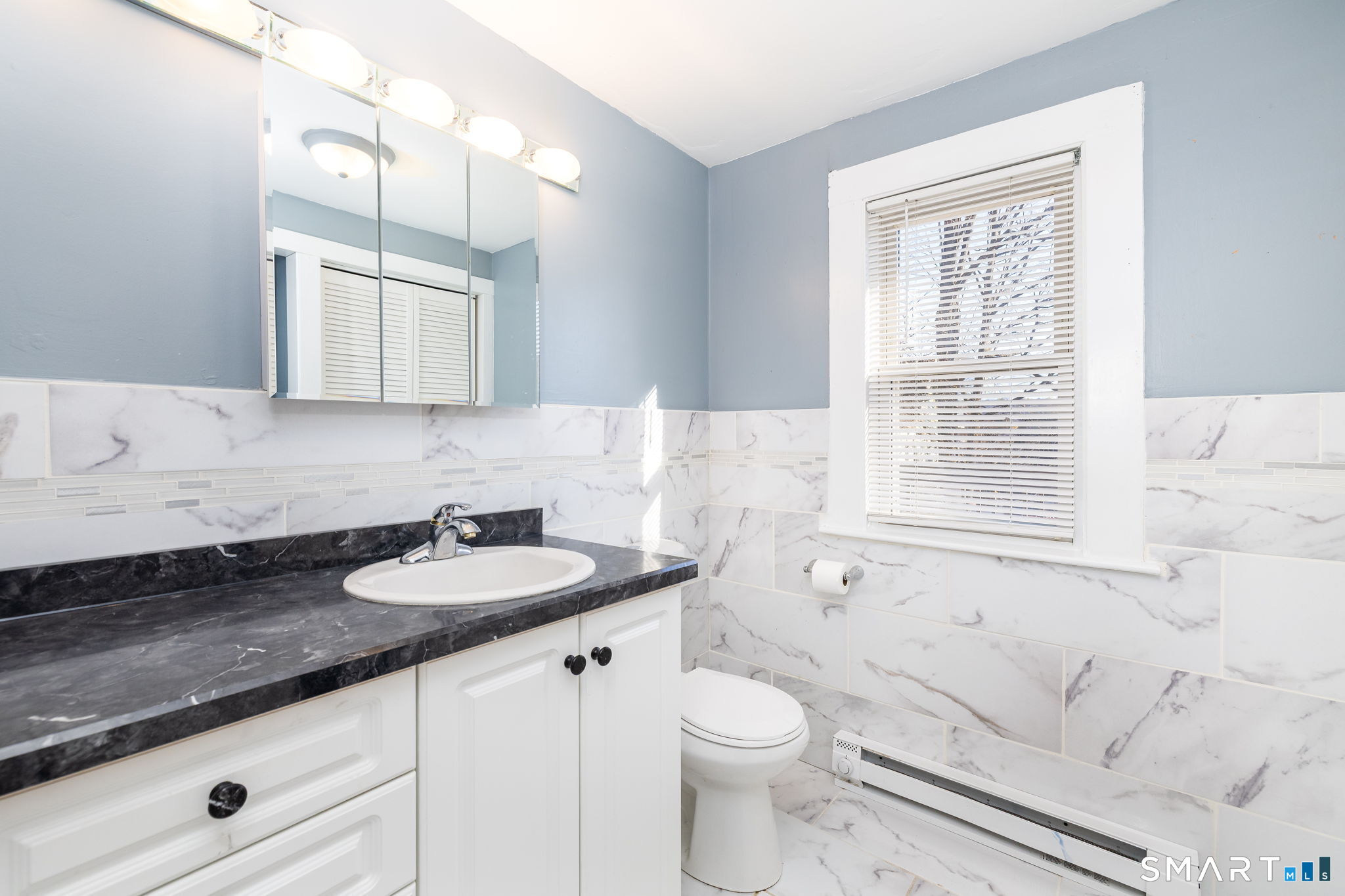 74 Pierpont Street Waterbury, CT 06708 - Photo 20 of 38 1st floor 1/2 bath with laundry hook ups.