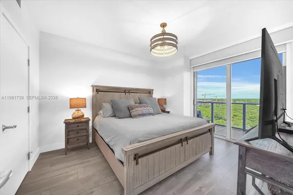 a view of a big room with wooden floor and fence