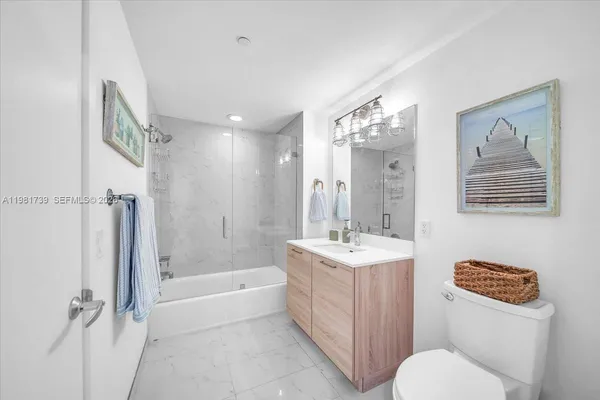 a workspace room with wooden floor a glass table and chair