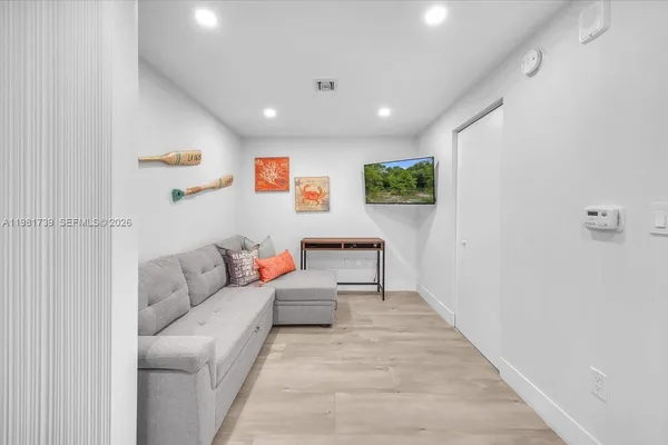 a bedroom with furniture and a window