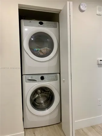a close view of kitchen sink with wooden floor