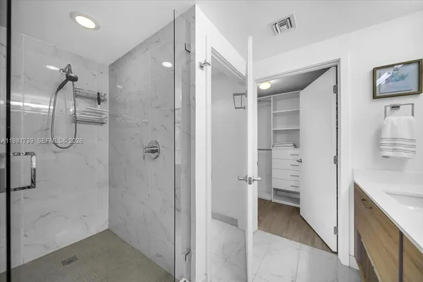 a living room with furniture a wooden floor and next to window