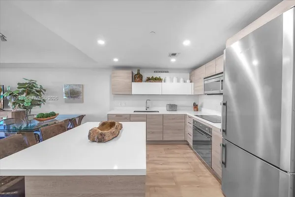 a view of a bathroom with a tub and window