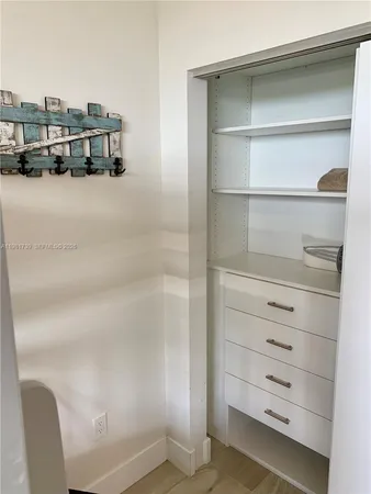 a front view of a swimming pool with outdoor seating