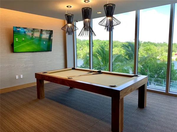 a view of a living room with bathroom