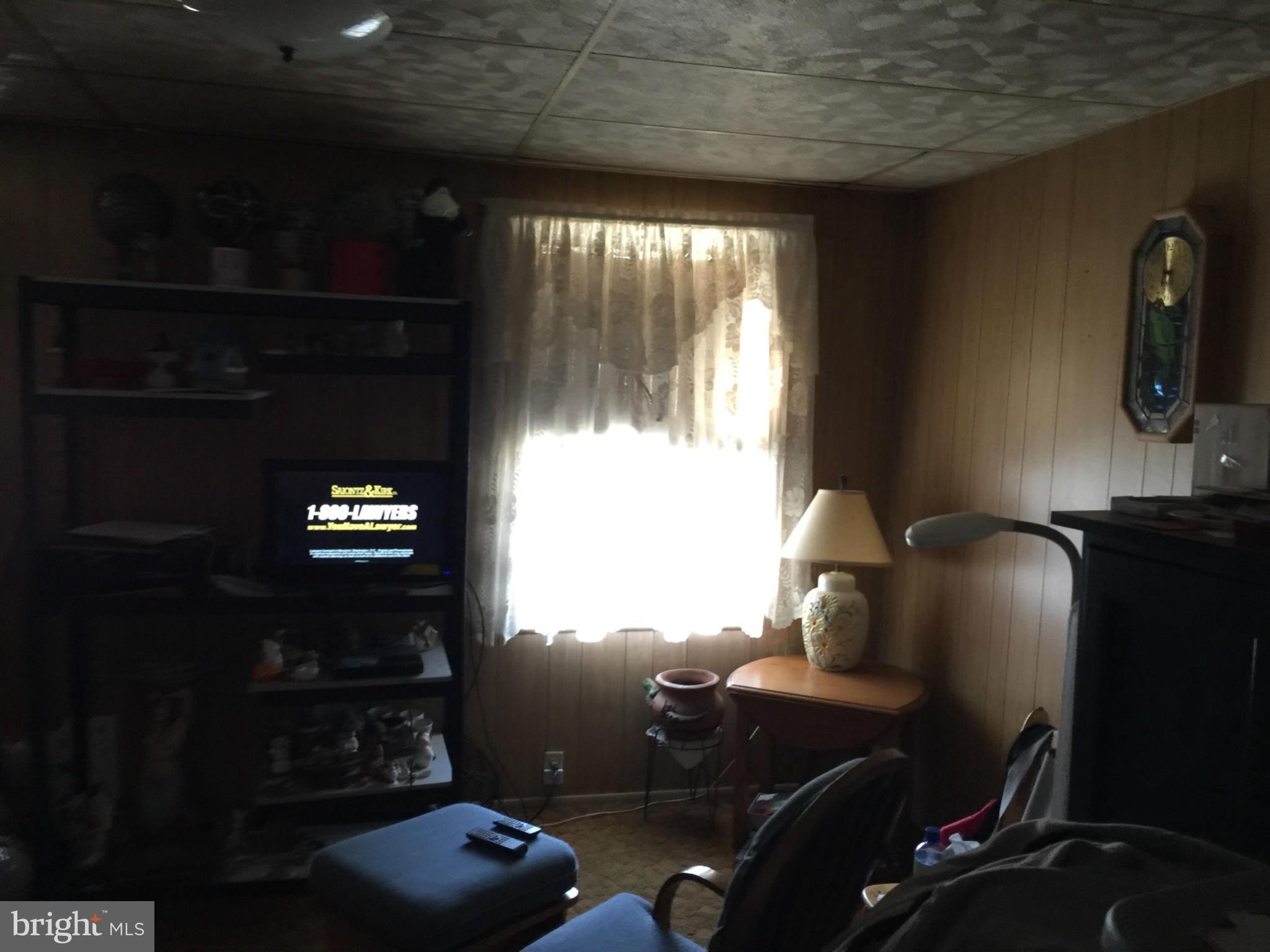 21 Portship Road Baltimore, MD 21222 - Photo 5 of 9 a room with furniture and window