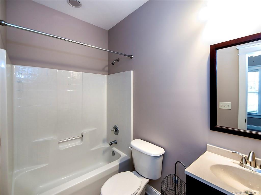 298 Elis Way, Unit 298 Fort Mill, SC 29708 - Photo 12 of 19 a white toilet sitting next to a bathroom sink