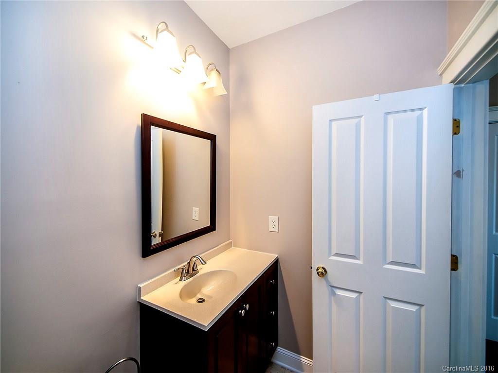 298 Elis Way, Unit 298 Fort Mill, SC 29708 - Photo 13 of 19 a bathroom with a sink vanity and mirror