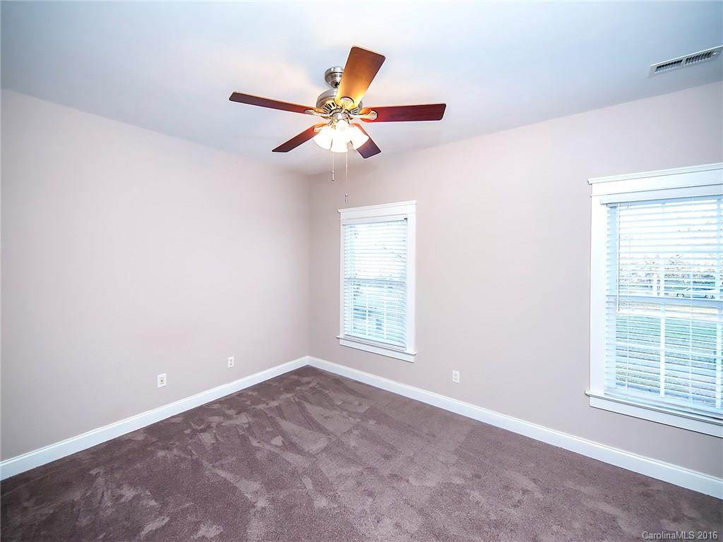 298 Elis Way, Unit 298 Fort Mill, SC 29708 - Photo 14 of 19 an empty room with windows and fan