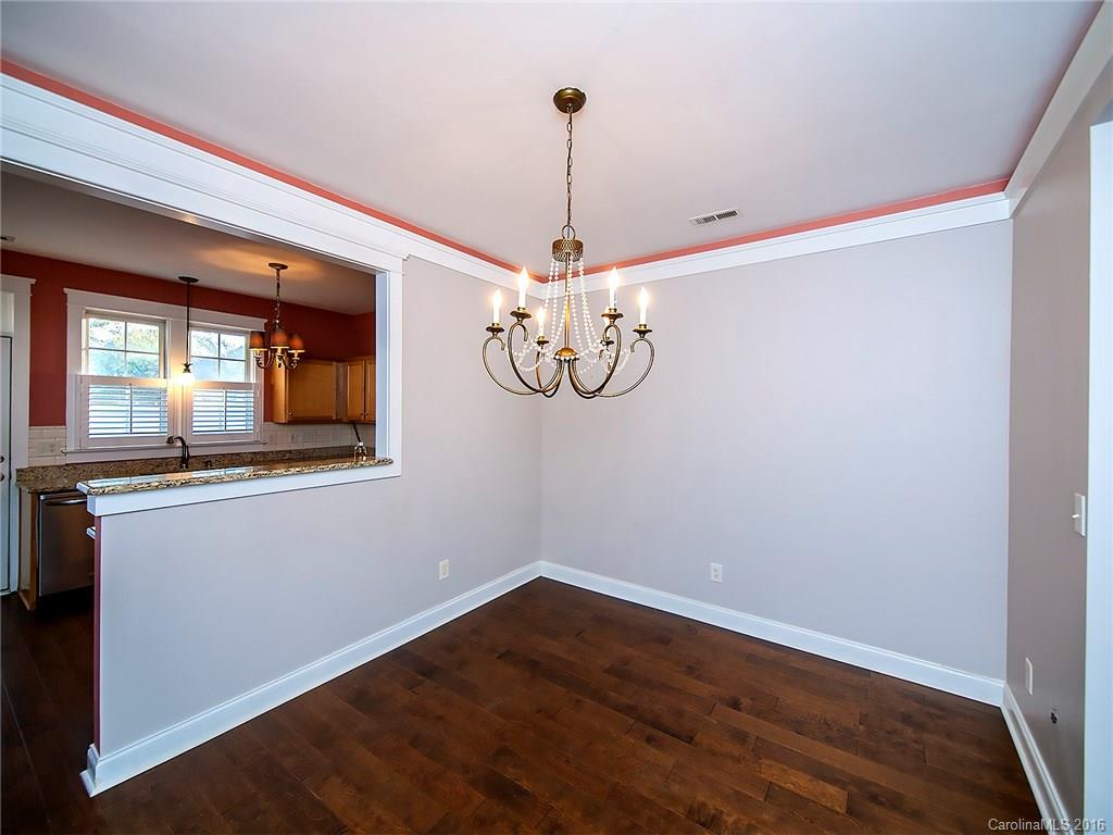 298 Elis Way, Unit 298 Fort Mill, SC 29708 - Photo 4 of 19 a view of a room with wooden floor and white walls