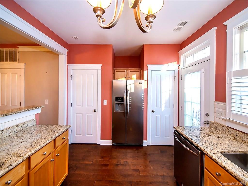 298 Elis Way, Unit 298 Fort Mill, SC 29708 - Photo 8 of 19 a kitchen with stainless steel appliances granite countertop a stove and a refrigerator