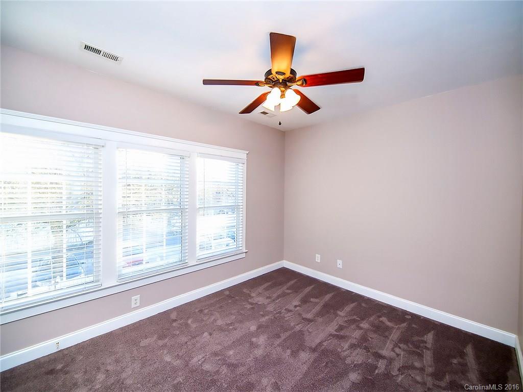 298 Elis Way, Unit 298 Fort Mill, SC 29708 - Photo 10 of 19 wooden floor in an empty room with a window