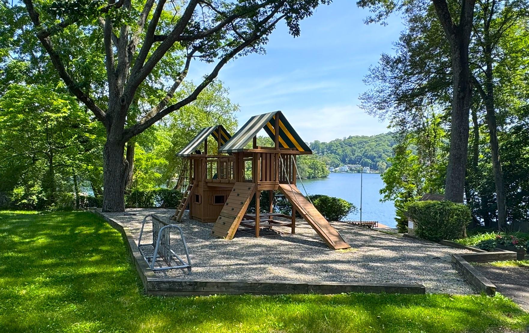 39 Woodland Road Mahopac, NY 10541 - Photo 19 of 21 a view of playground with a slide and swing