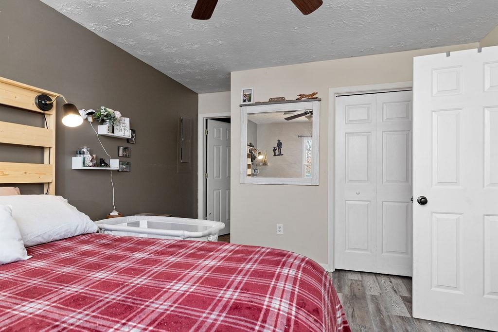 149 China Clay Road Stuarts Draft, VA 24477 - Photo 12 of 22 a bedroom with a bed and wooden floor