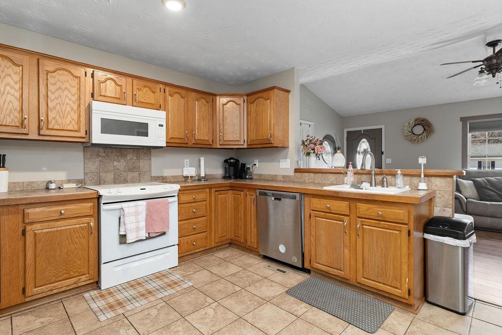 149 China Clay Road Stuarts Draft, VA 24477 - Photo 8 of 22 a kitchen with stainless steel appliances granite countertop a sink and cabinets