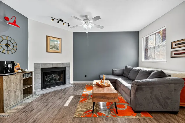 a living room with furniture and a fireplace