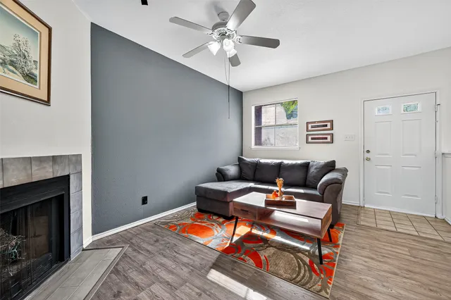a living room with furniture and a fireplace