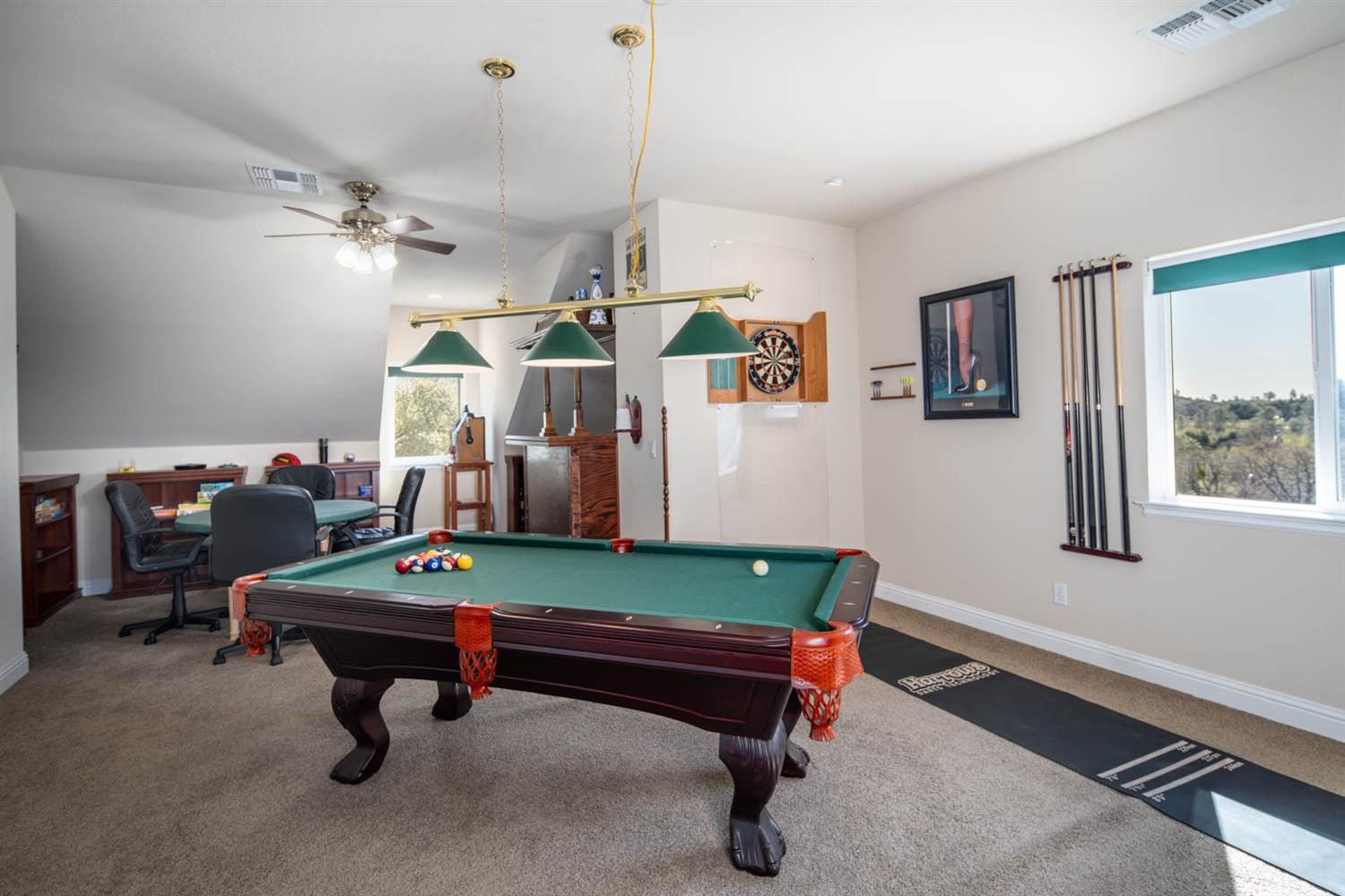 2661 Mountain Oak Lane Rescue, CA 95672 - Photo 38 of 88 Large game room with wet bar, movie viewing area and views of the lake and city of Sacramento