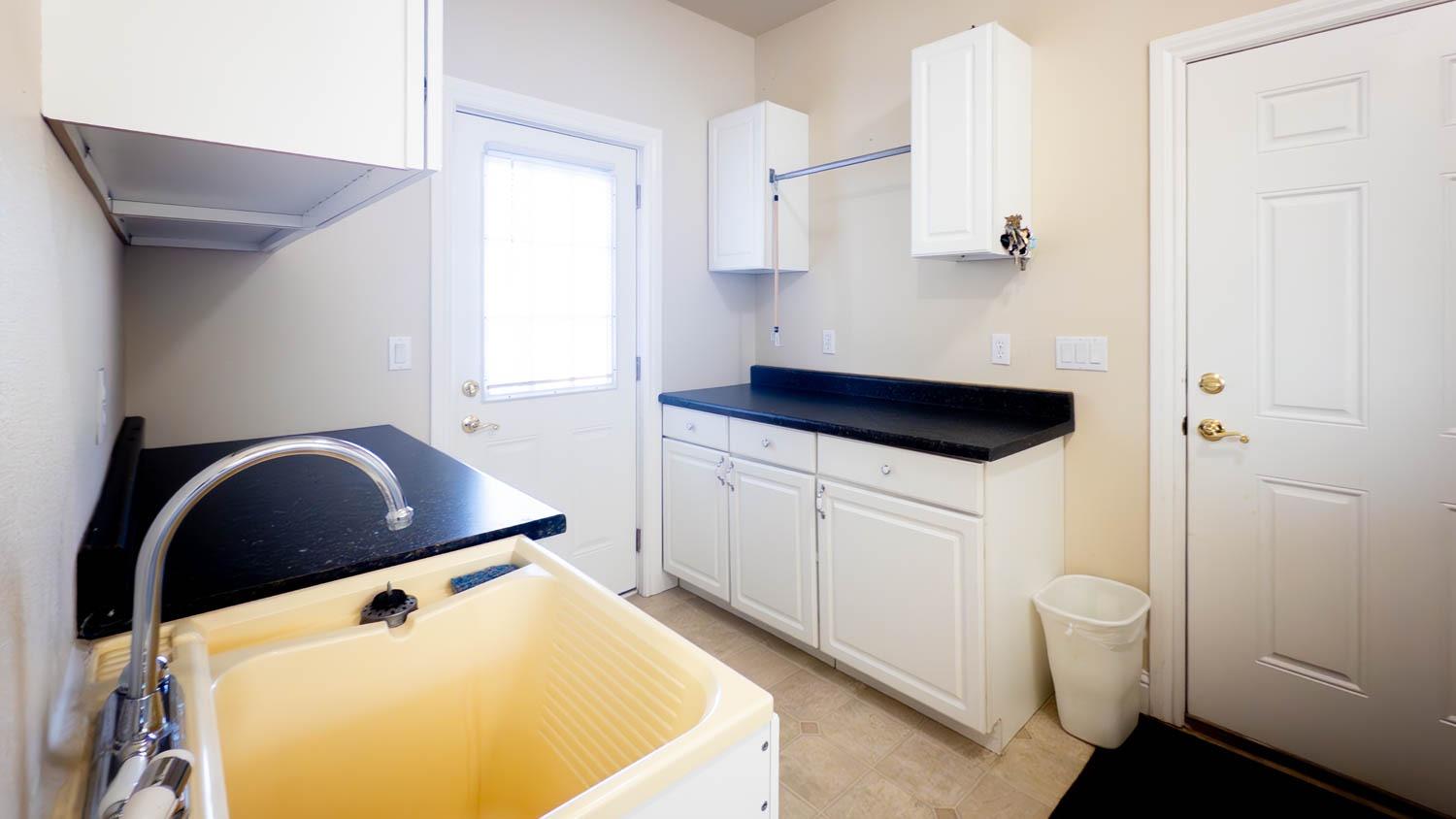 2661 Mountain Oak Lane Rescue, CA 95672 - Photo 47 of 88 Large walk in laundry room with Garage access, sink and extra storage