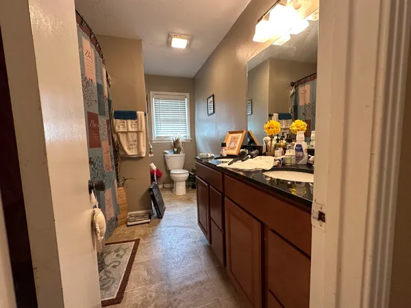 a room with furniture and wooden floor