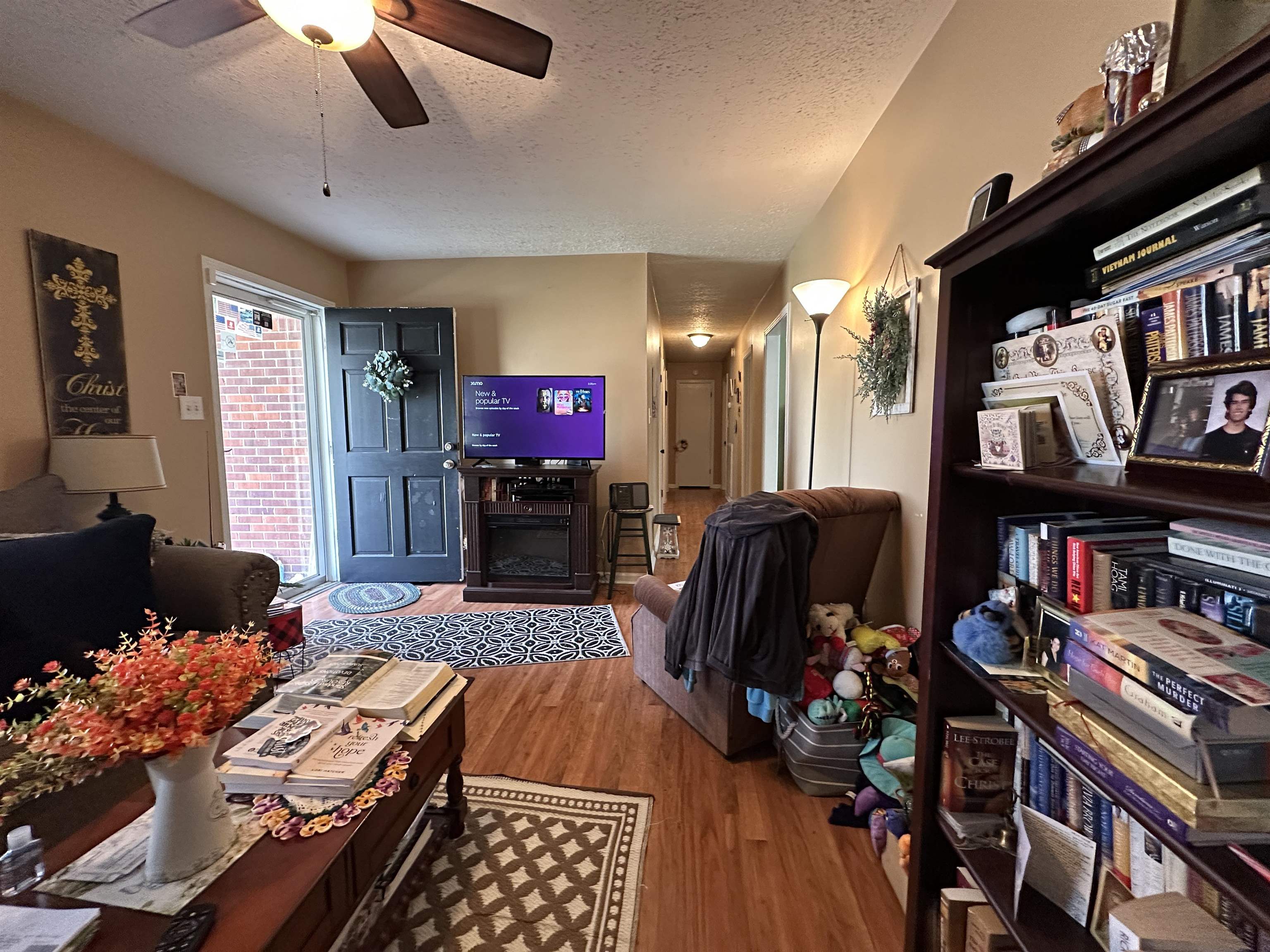 92 Puron Road Adamsville, TN 38310 - Photo 13 of 23 a living room with lots of furniture and a flat screen tv