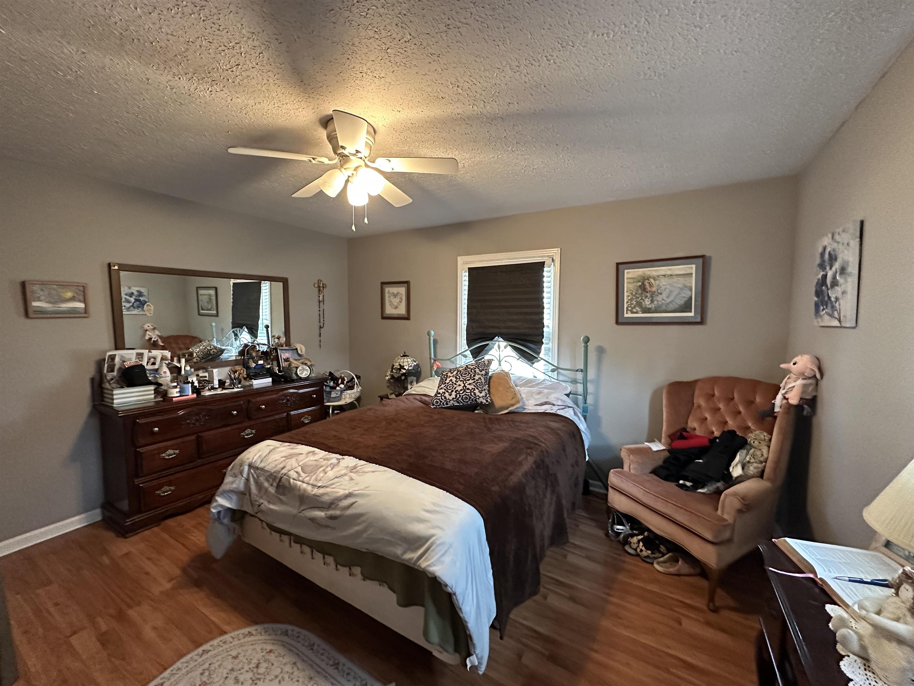 92 Puron Road Adamsville, TN 38310 - Photo 18 of 23 a bedroom with a bed couches and furniture