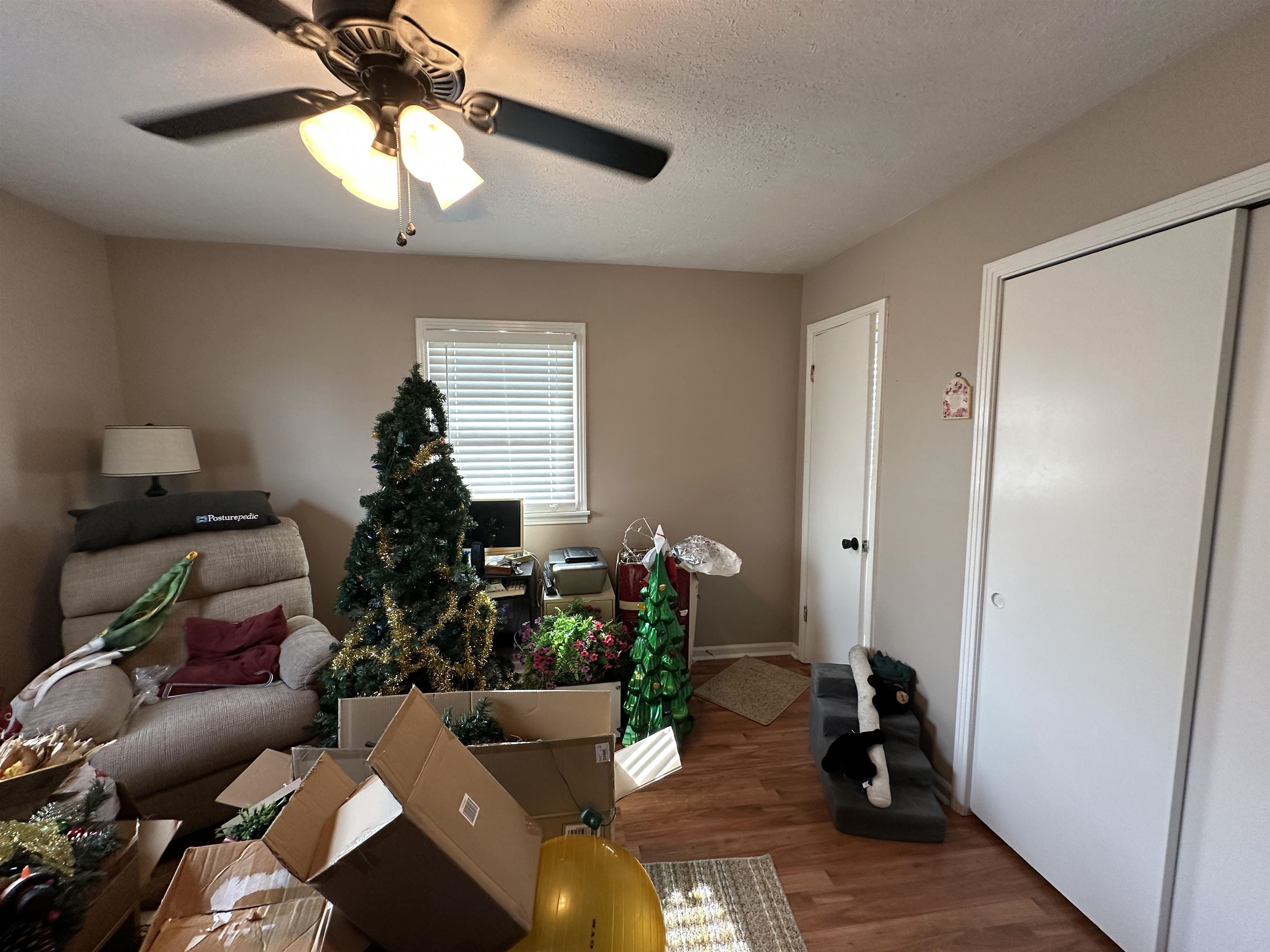 92 Puron Road Adamsville, TN 38310 - Photo 19 of 23 a living room with furniture and a chandelier