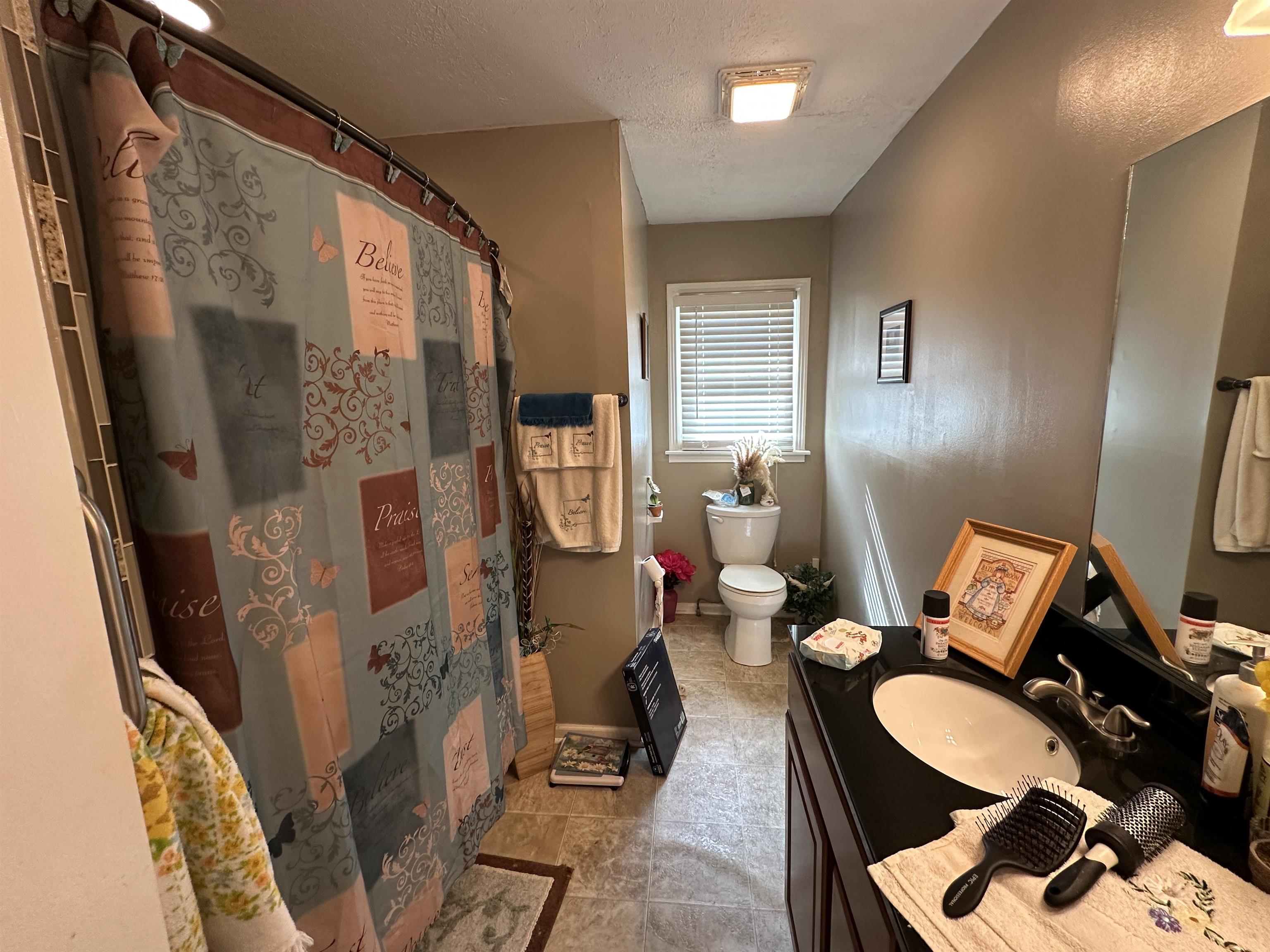 92 Puron Road Adamsville, TN 38310 - Photo 2 of 23 a room with furniture and wooden floor