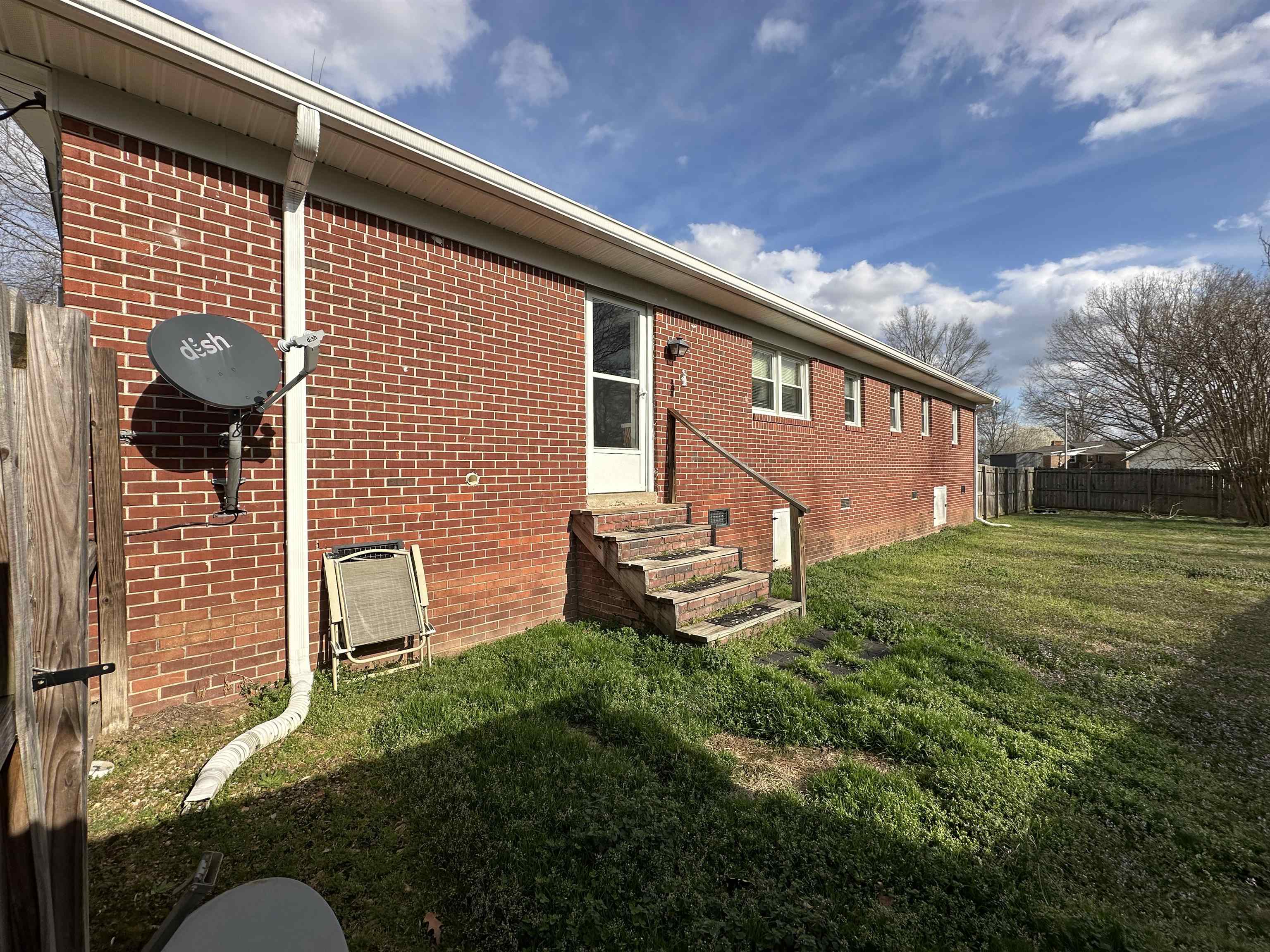 92 Puron Road Adamsville, TN 38310 - Photo 21 of 23 a backyard of a house with lots of green space
