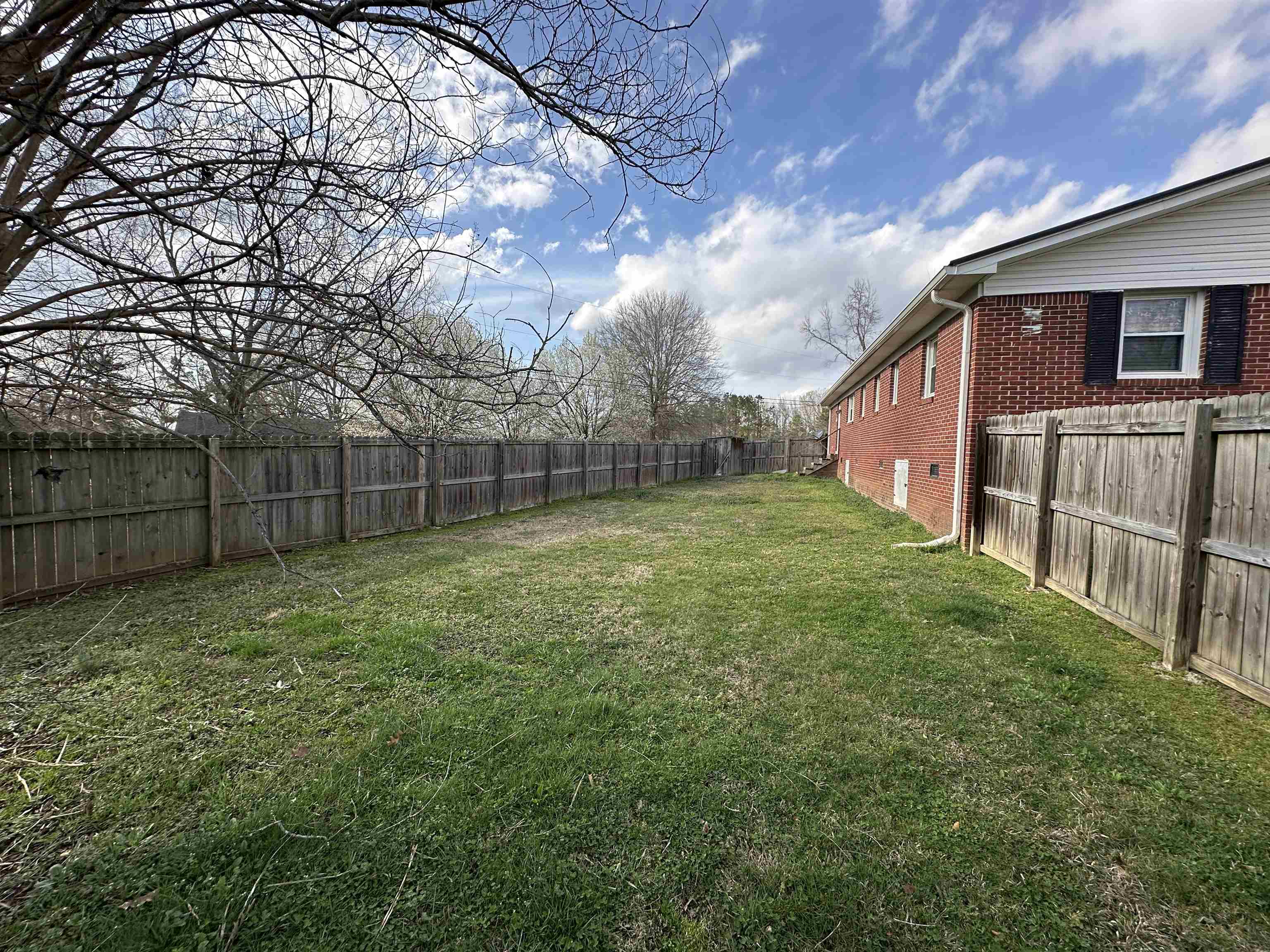 92 Puron Road Adamsville, TN 38310 - Photo 23 of 23 a view of a backyard with white fence
