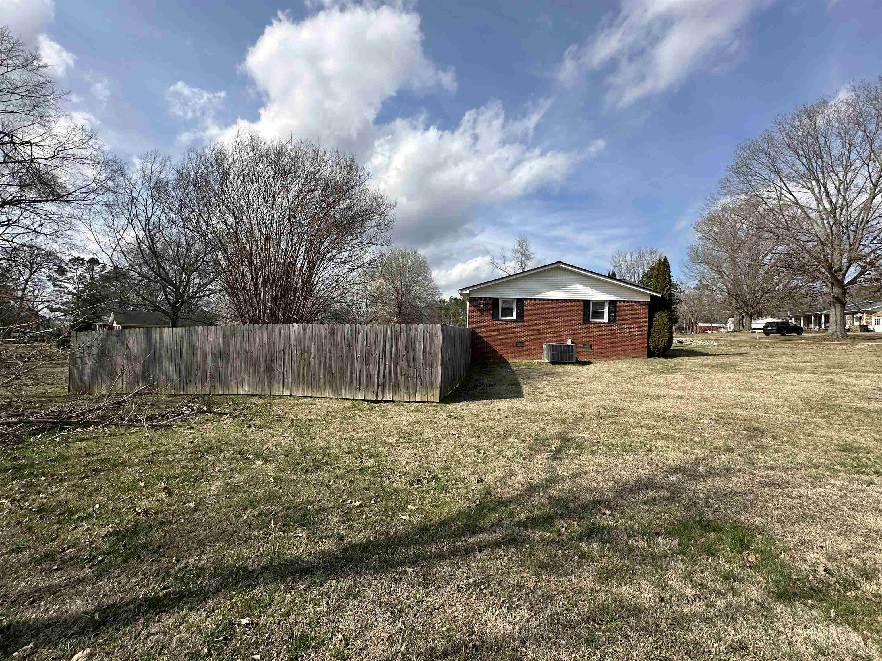 92 Puron Road Adamsville, TN 38310 - Photo 6 of 23 a front view of a house with a yard