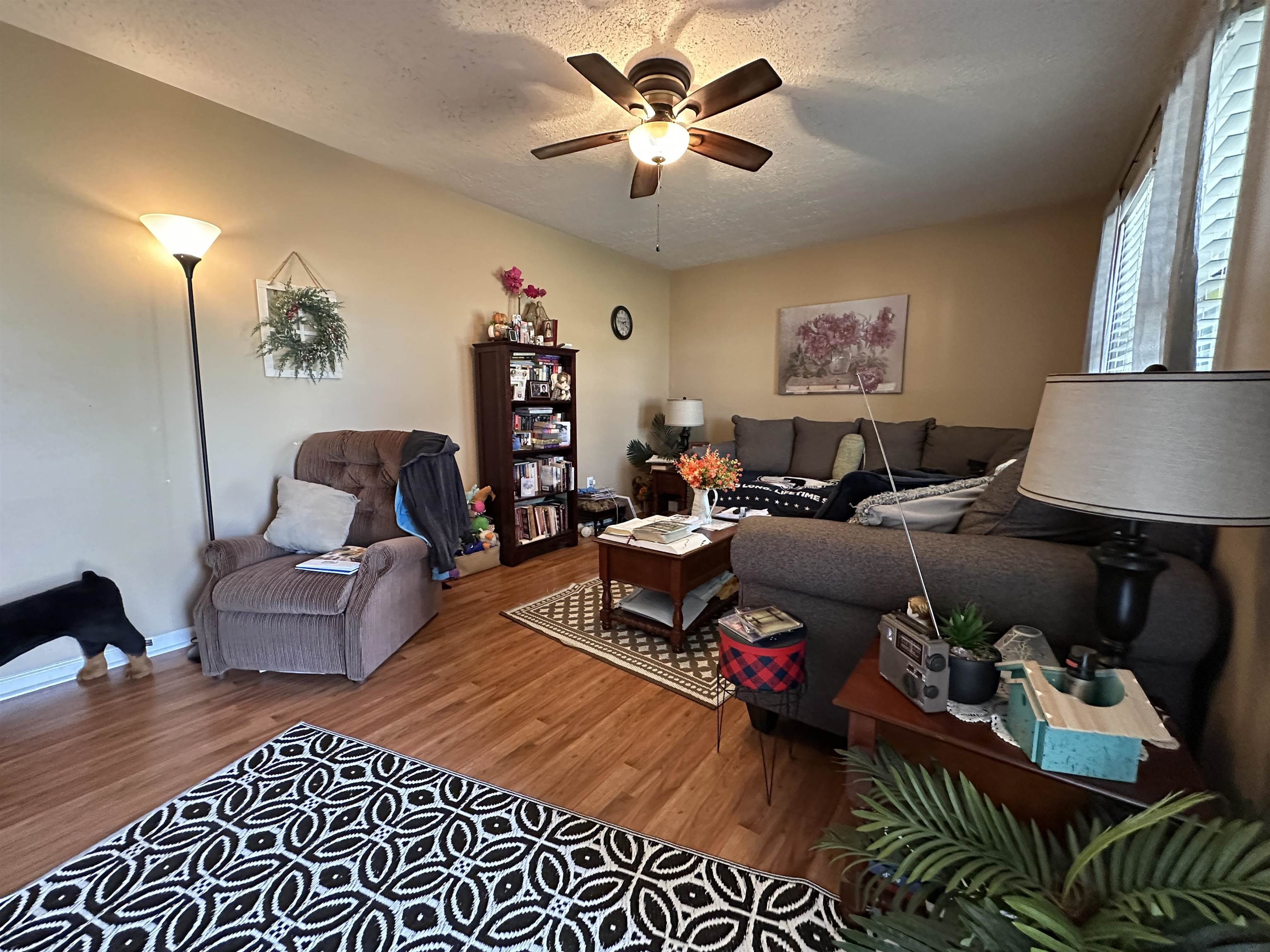 92 Puron Road Adamsville, TN 38310 - Photo 8 of 23 a living room with furniture and a lamp