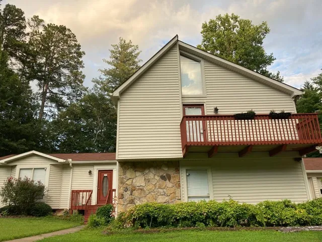 a view of a house with a yard and plants